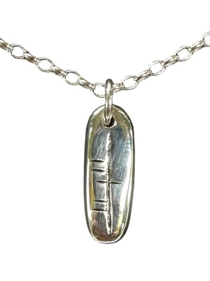 Carved ogham initial pendant