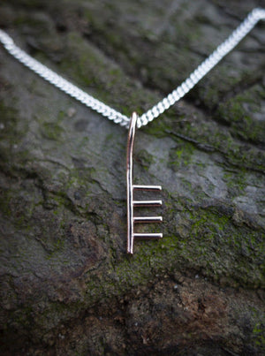 red gold ogham initial