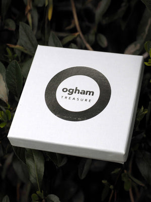 ogham treasure logo printed on a box