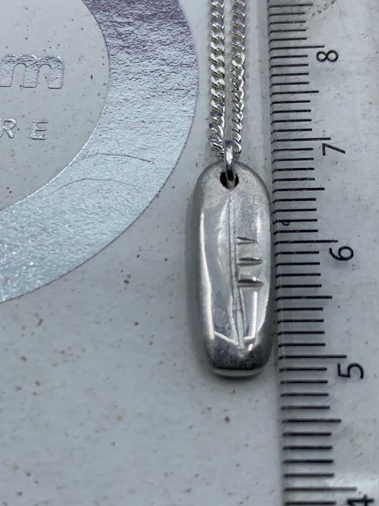 Carved initial pendant